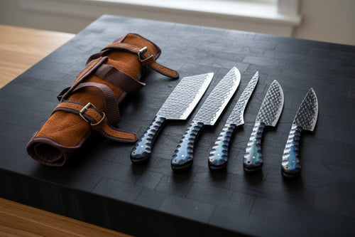 Set of knives with blue handles and a brown leather sheath on a white background