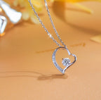 Dainty heart-cut moissanite pendant on a sterling silver chain
