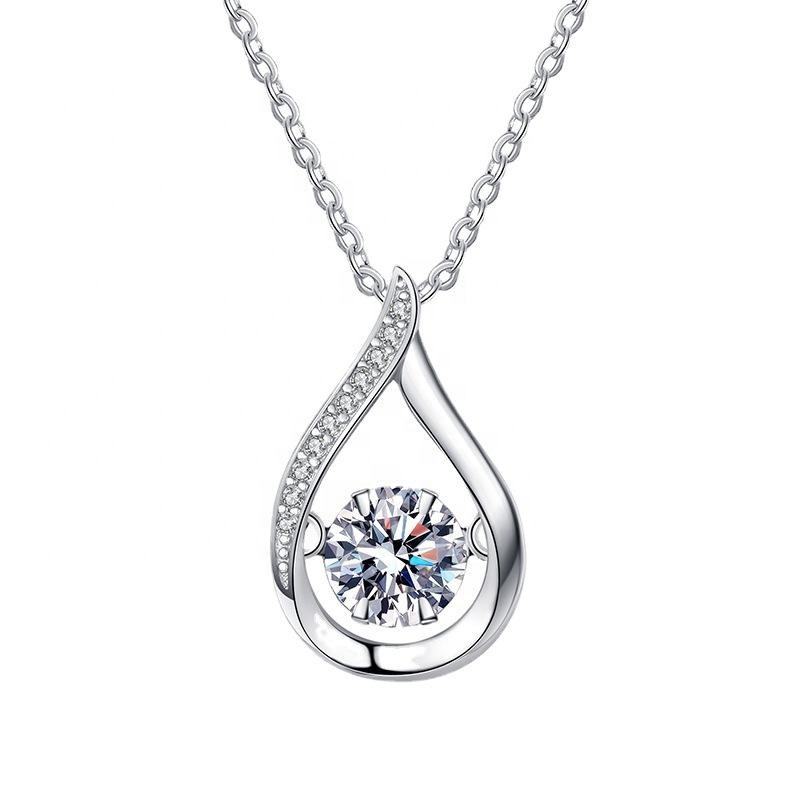 Teardrop moissanite pendant on a sterling silver Cuban link chain