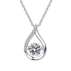 Teardrop moissanite pendant on a sterling silver Cuban link chain