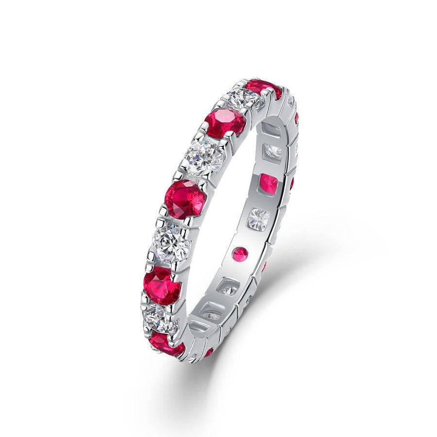 Red and white moissanite eternity band in 18K gold over sterling silver