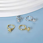 North star drop earrings on small huggie hoops