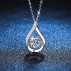 Sterling silver Cuban chain necklace with a teardrop moissanite pendant
