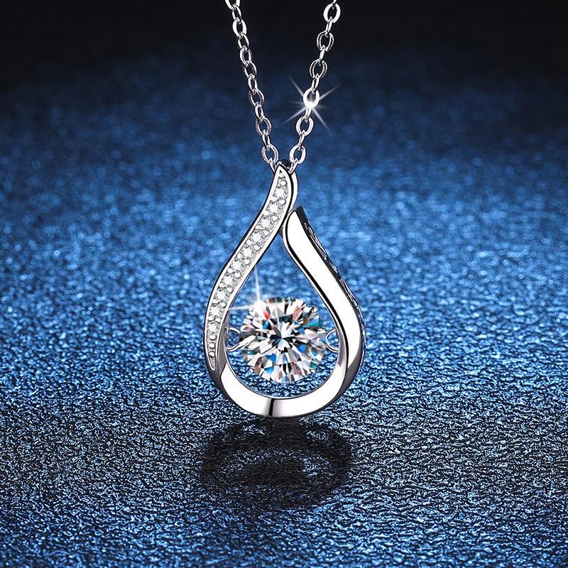 Sterling silver Cuban chain necklace with a teardrop moissanite pendant
