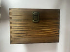 Front of the hinged wooden whiskey gift box with metal clasp