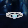 Sterling silver Claddagh ring with a heart-cut created opal